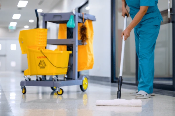 Services closeup mop cleaning office floor 600nw 2511302389